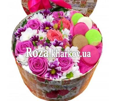 Box with flowers and macaroons