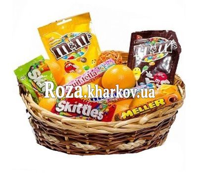 Basket with oranges and sweets Basket with oranges and sweets