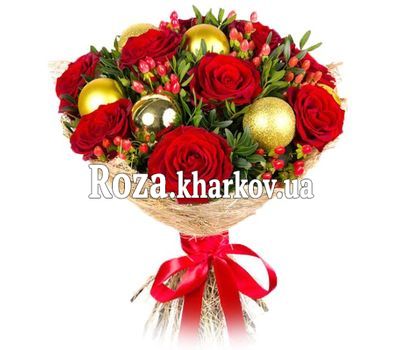A bouquet of roses with a Christmas decoration