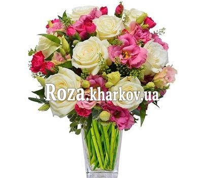 White roses and pink eustomas in a bouquet